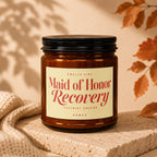 Brown glass candle labeled "Maid of Honor Recovery".