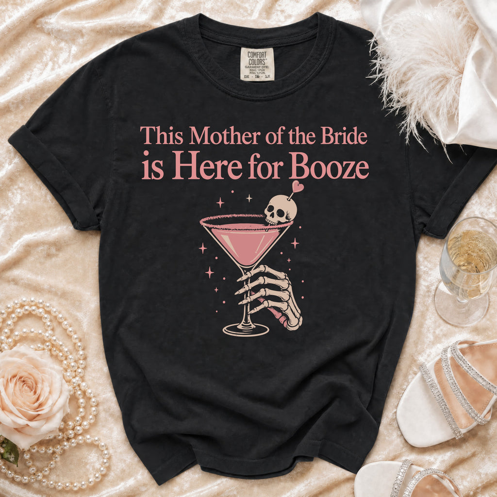 Black t-shirt with "This Mother of the Bride is Here for Booze" text and skeleton hand holding cocktail.