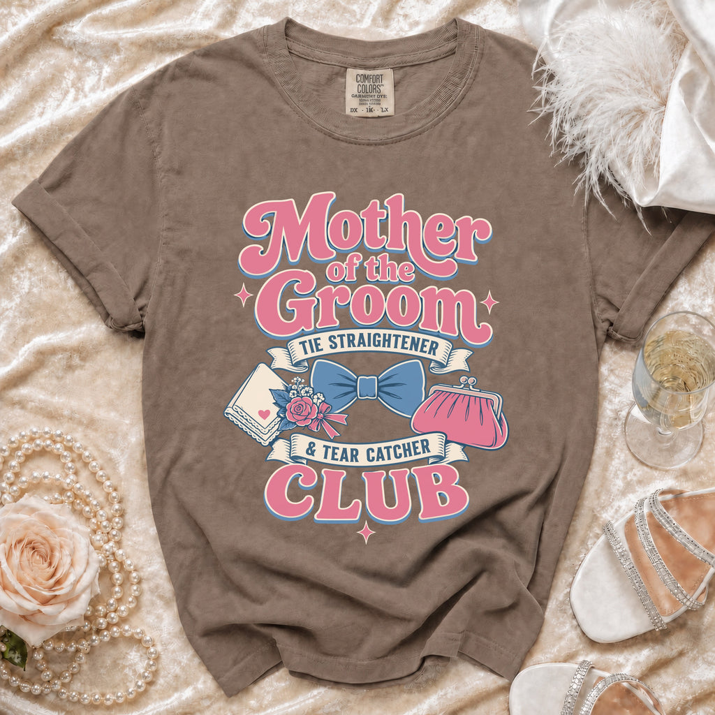Brown t-shirt with "Mother of the Groom Tie Straightener & Tear Catcher Club" text.