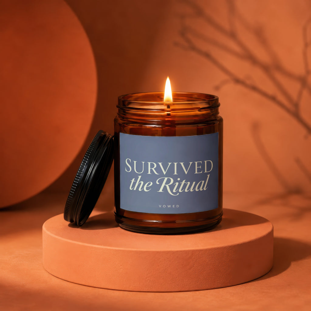 Amber jar candle with lit flame, "SURVIVED the Ritual" text, VOWED below.