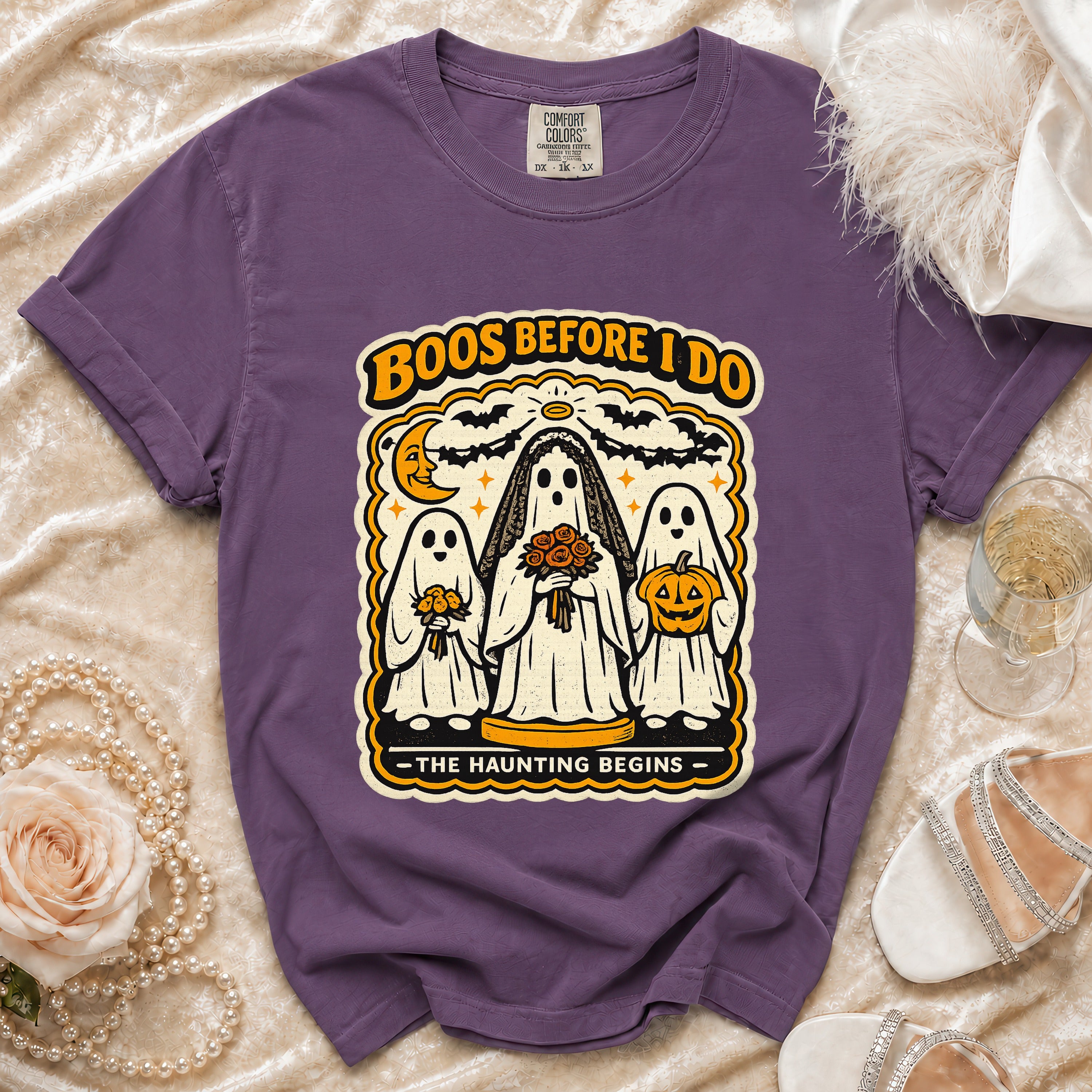 Purple t-shirt with a "Boos Before I Do" graphic featuring ghosts in wedding attire.
