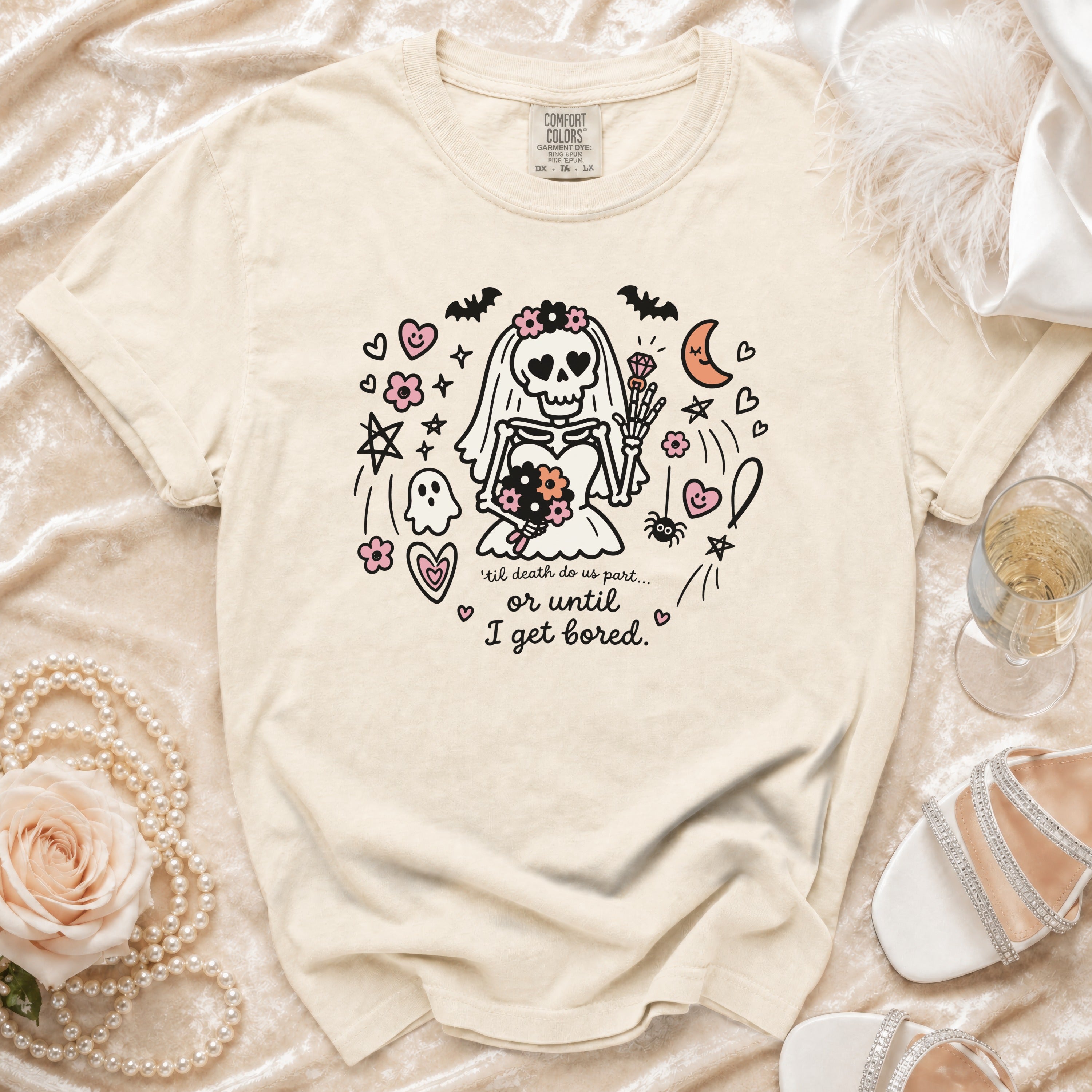 Cream t-shirt featuring a cartoon skeleton bride graphic with the text till death do us part or until I get bored.