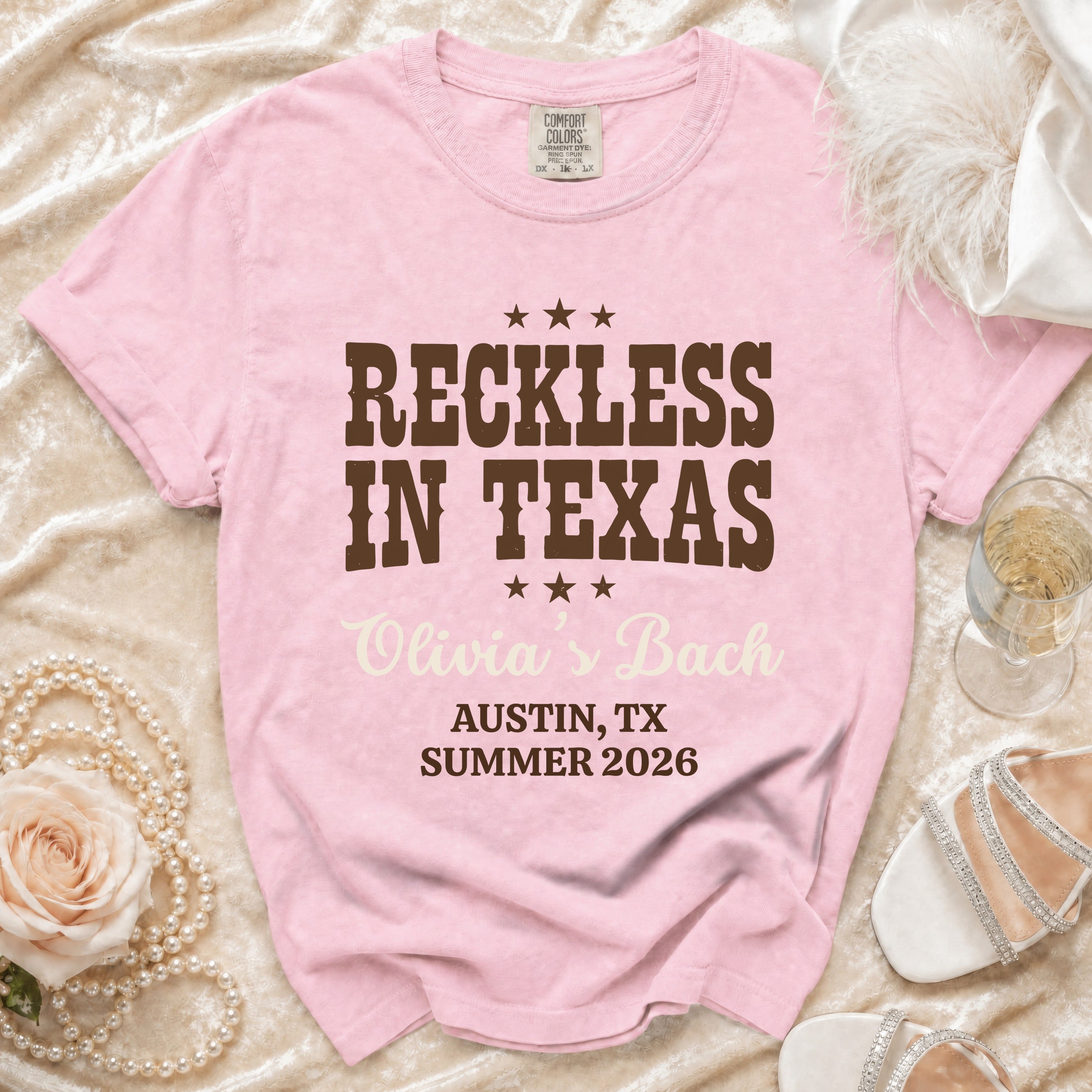 Pink Comfort Colors t-shirt: Reckless in Texas, Olivia's Bach, Austin, TX Summer 2026.