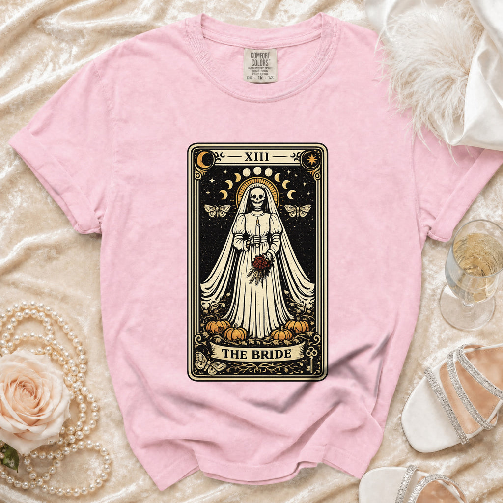 Pink t-shirt with a tarot card design of a skeleton bride labeled "The Bride" and "XIII".