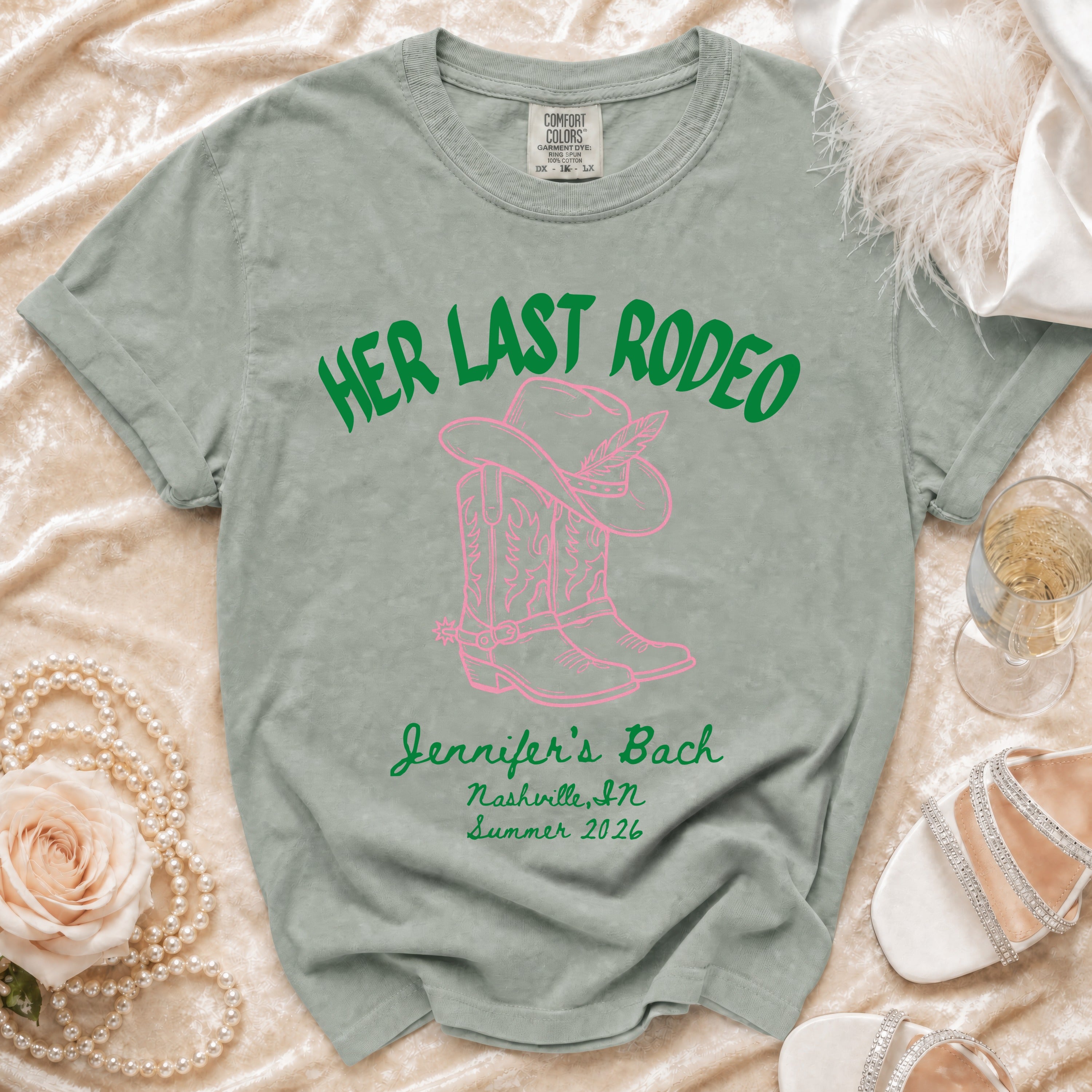 "Her Last Rodeo" text with cowboy boots and hat on a t-shirt.