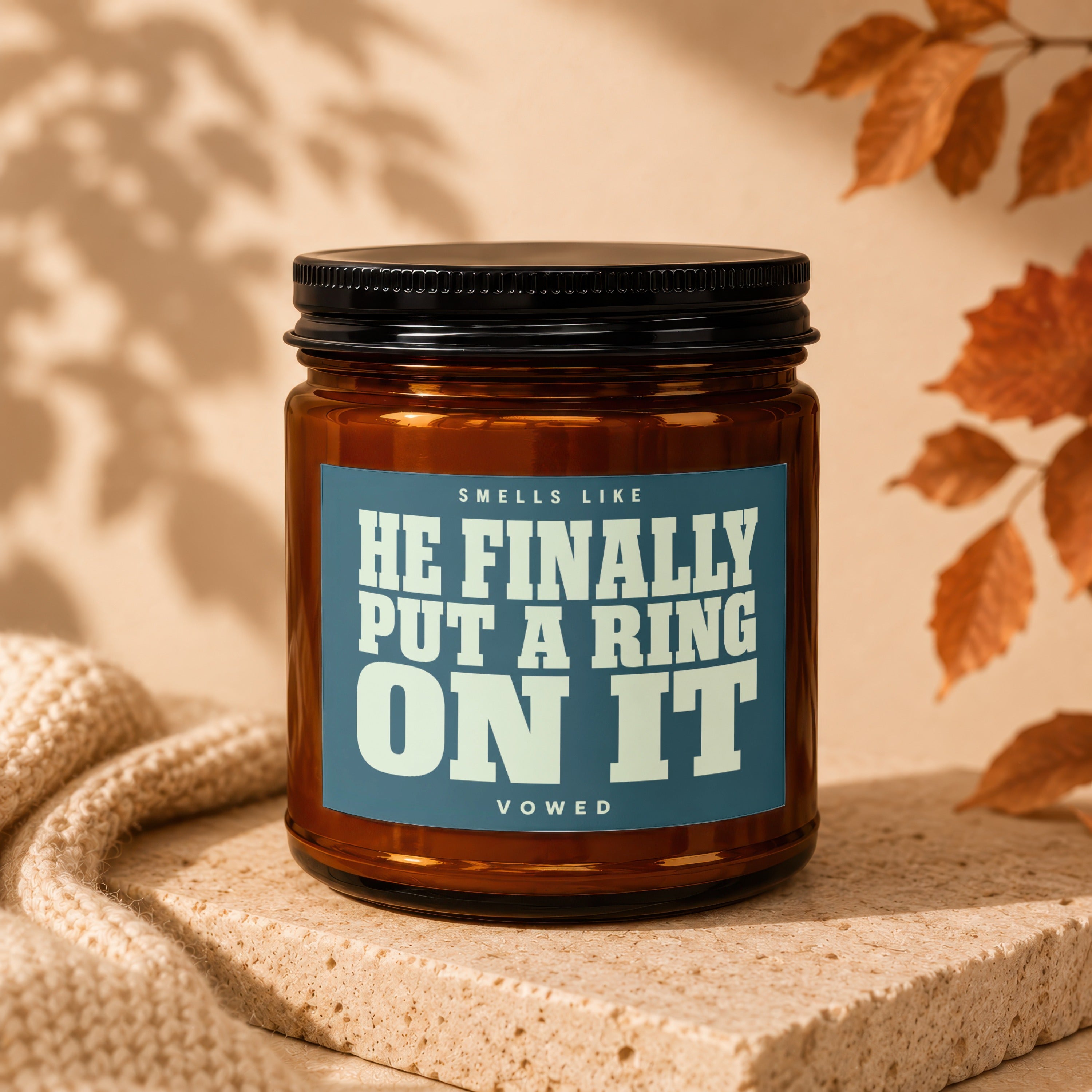 Amber jar candle with text "Smells like he finally put a ring on it" VOWED.