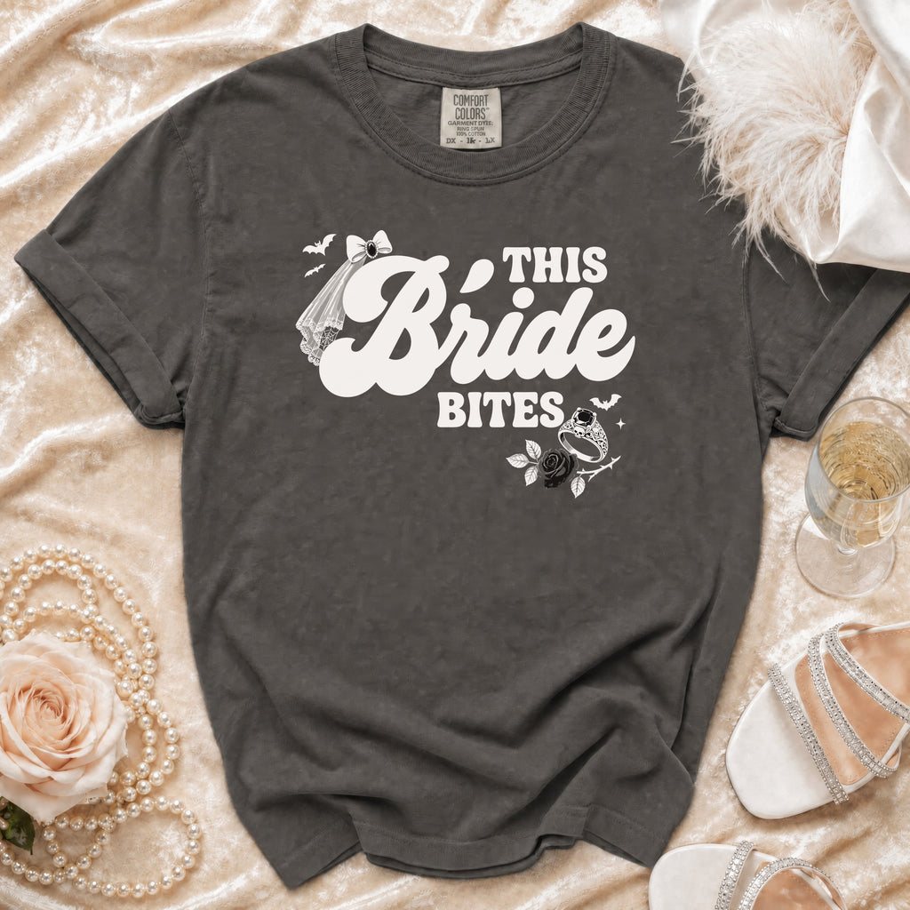 Dark grey t-shirt with "This Bride Bites" text, veil, ring, and bats graphic.