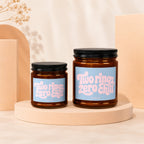 Two amber glass jars with black lids feature blue labels with pink text: "Two rings, zero chill."
