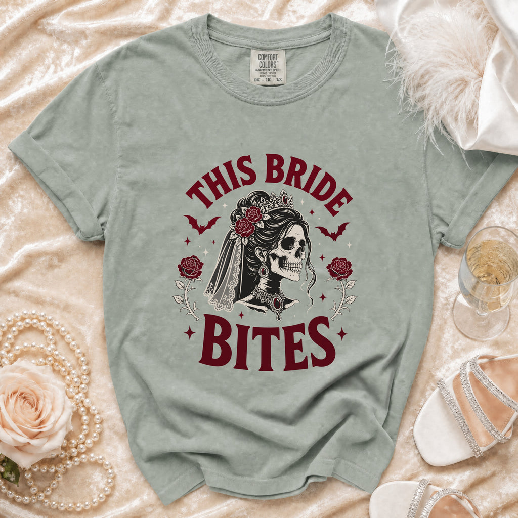 Light green t-shirt with "This Bride Bites" text and gothic bride skull graphic.