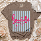 Brown comfort colors t-shirt with bold pink "bride" text on light blue stripes.