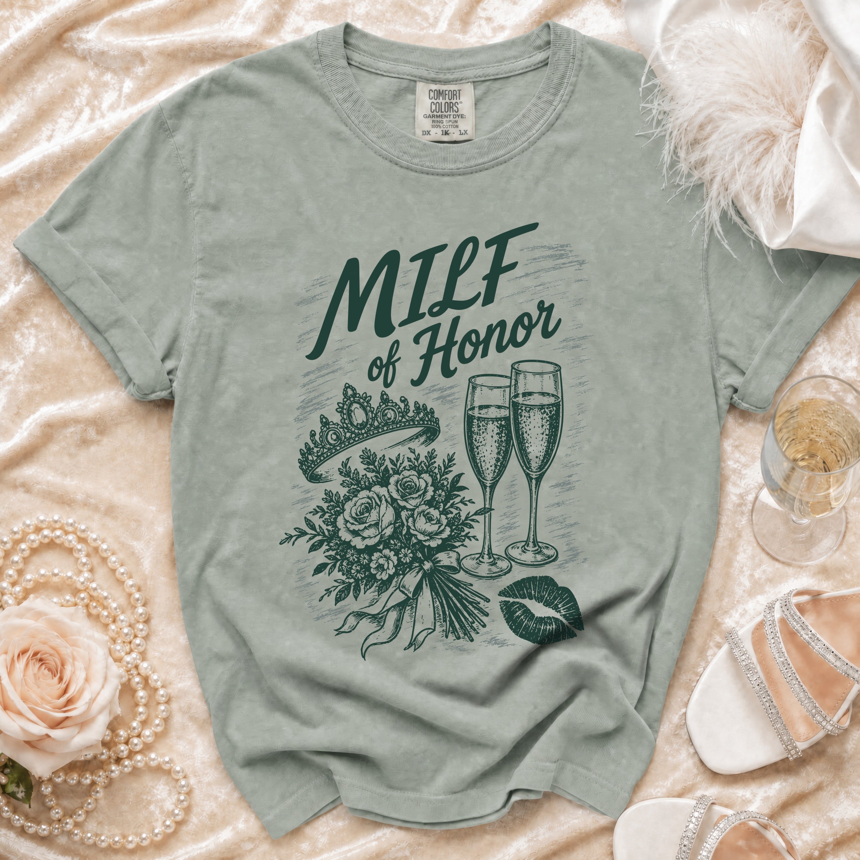 Green t-shirt with "MILF of Honor" text, bouquet, champagne glasses, and lipstick kiss.