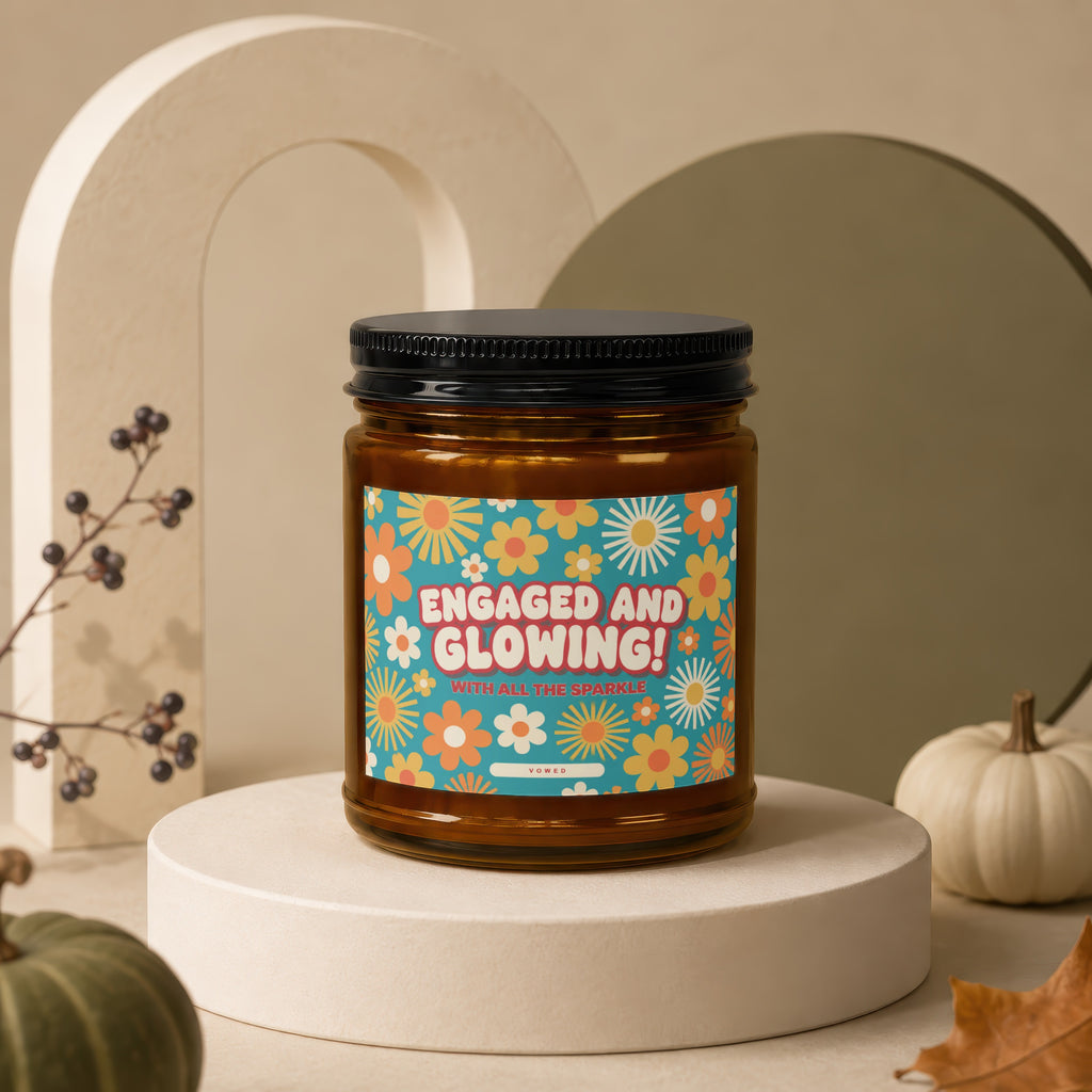Candle with "Engaged and Glowing! With All the Sparkle" text on a retro floral label.