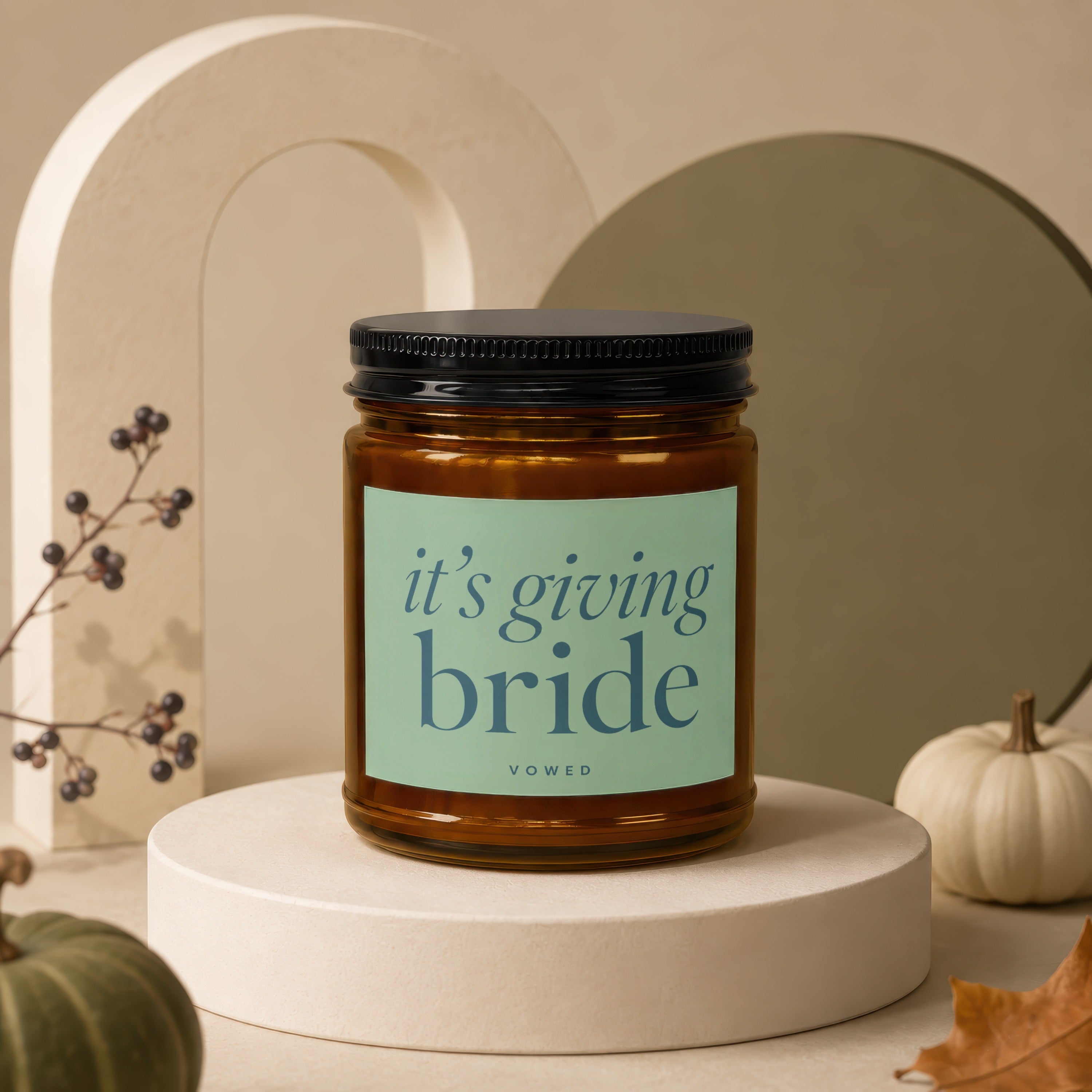 Amber candle with black lid and "it's giving bride" text on label.