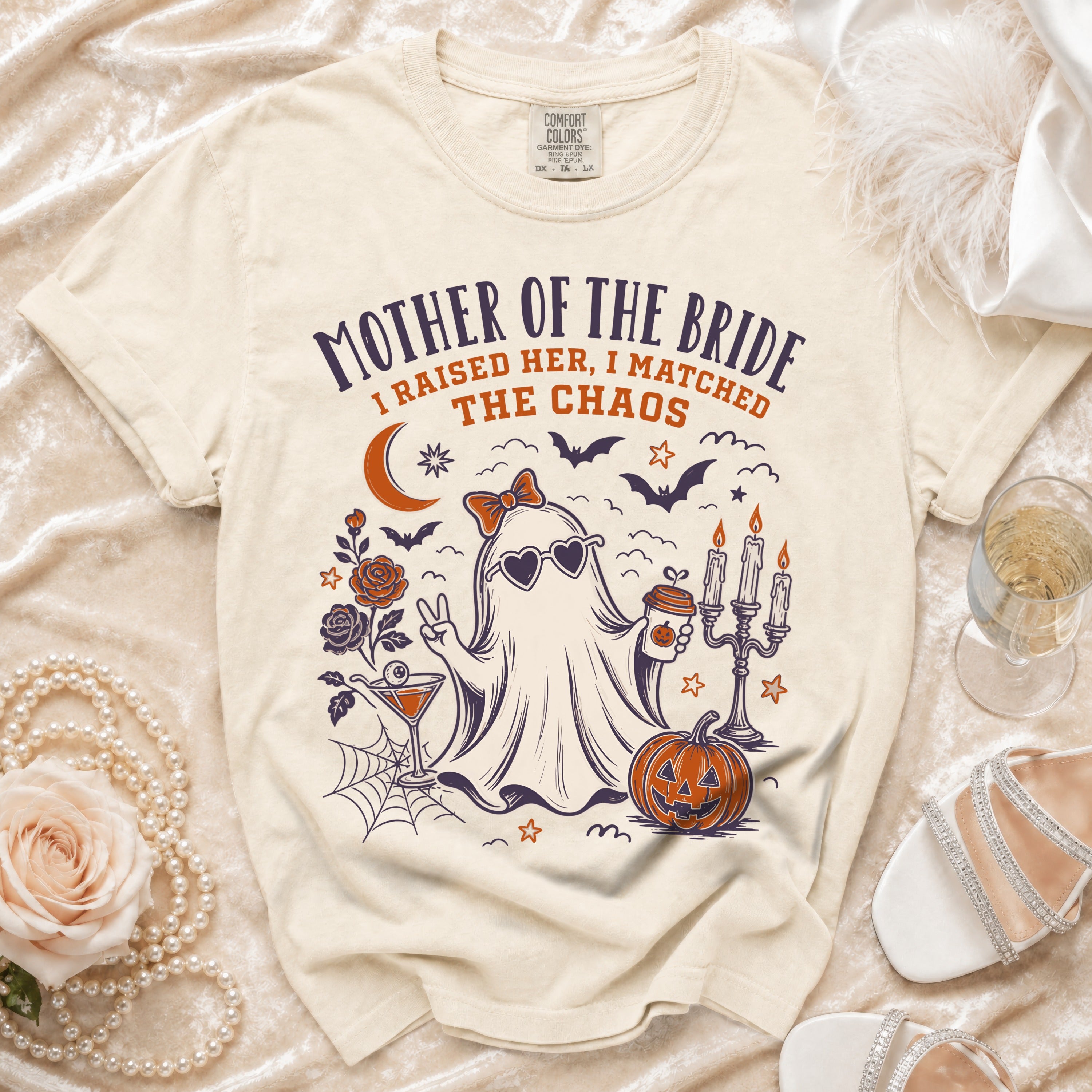 T-shirt with "Mother of the Bride I Raised Her, I Matched the Chaos" graphic.