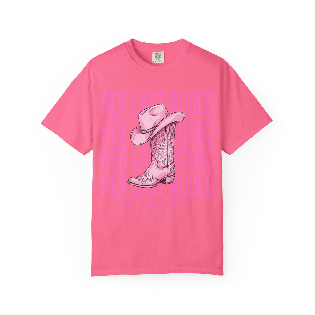 Pink t-shirt with "Her Last Rodeo" graphic featuring cowboy boot and hat.