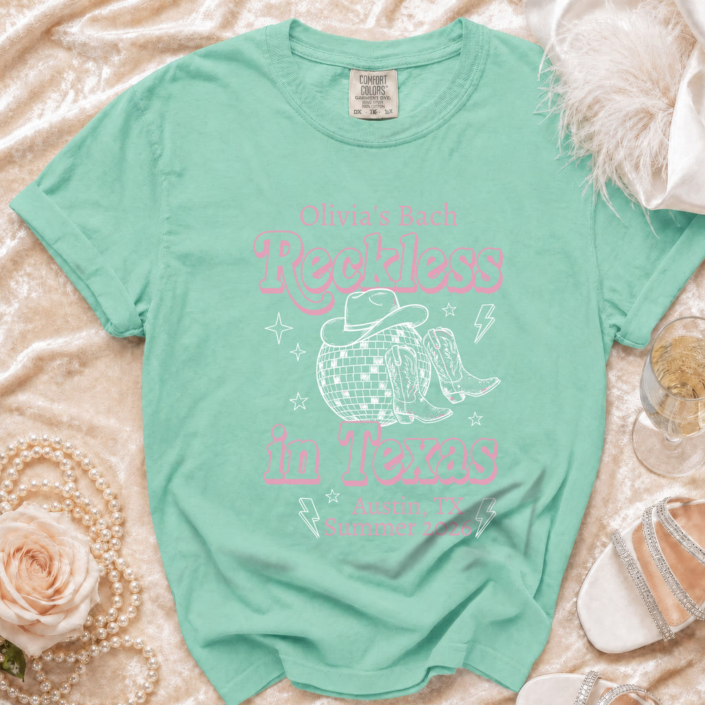 Mint green t-shirt with "Olivia's Back Reckless in Austin Texas Summer '24" graphic.