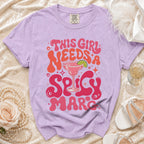 Purple t-shirt with "This girl needs a spicy marg" text and margarita graphic.