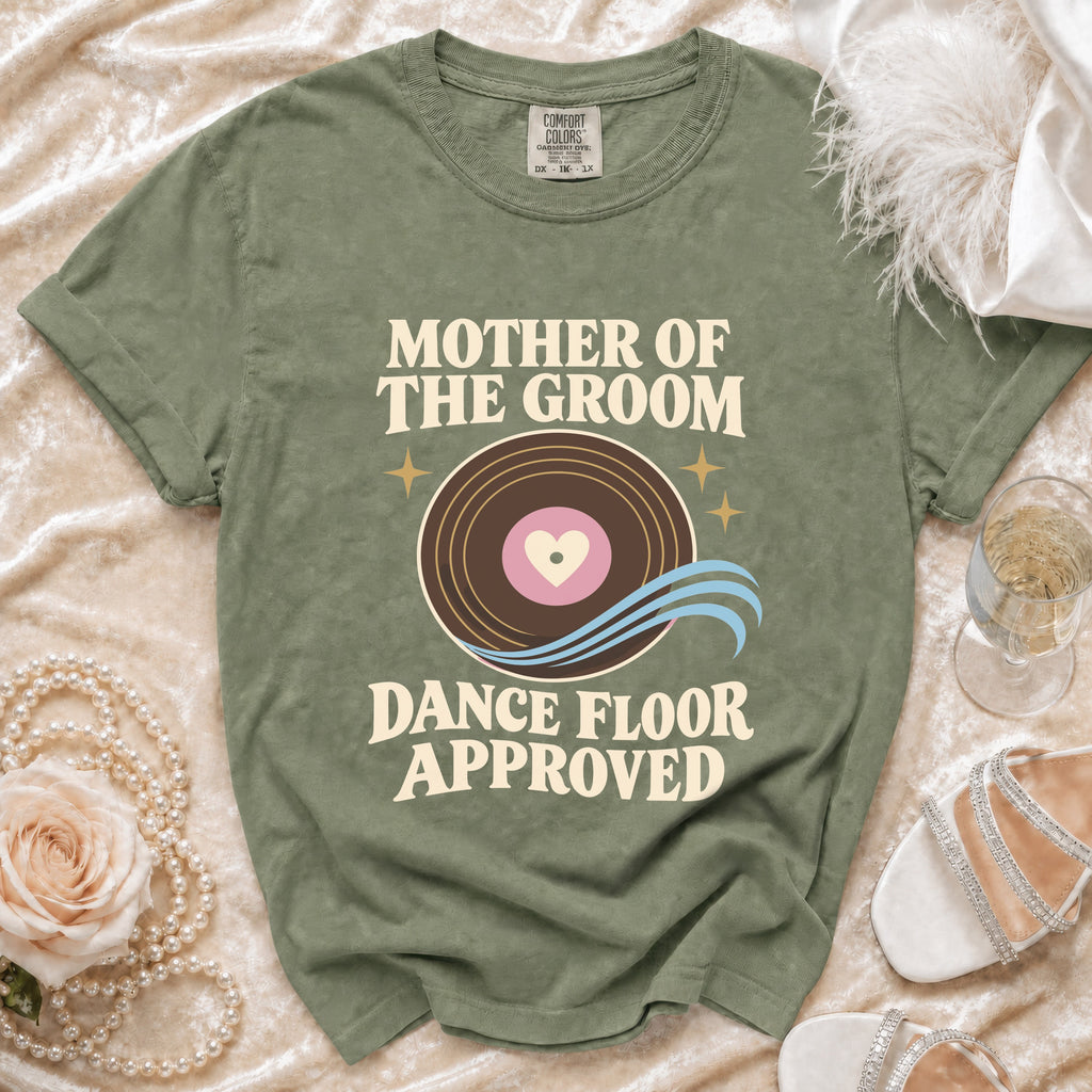 Green t-shirt with "Mother of the Groom Dance Floor Approved" text and vinyl record graphic.