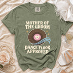 Green t-shirt with "Mother of the Groom Dance Floor Approved" text and vinyl record graphic.
