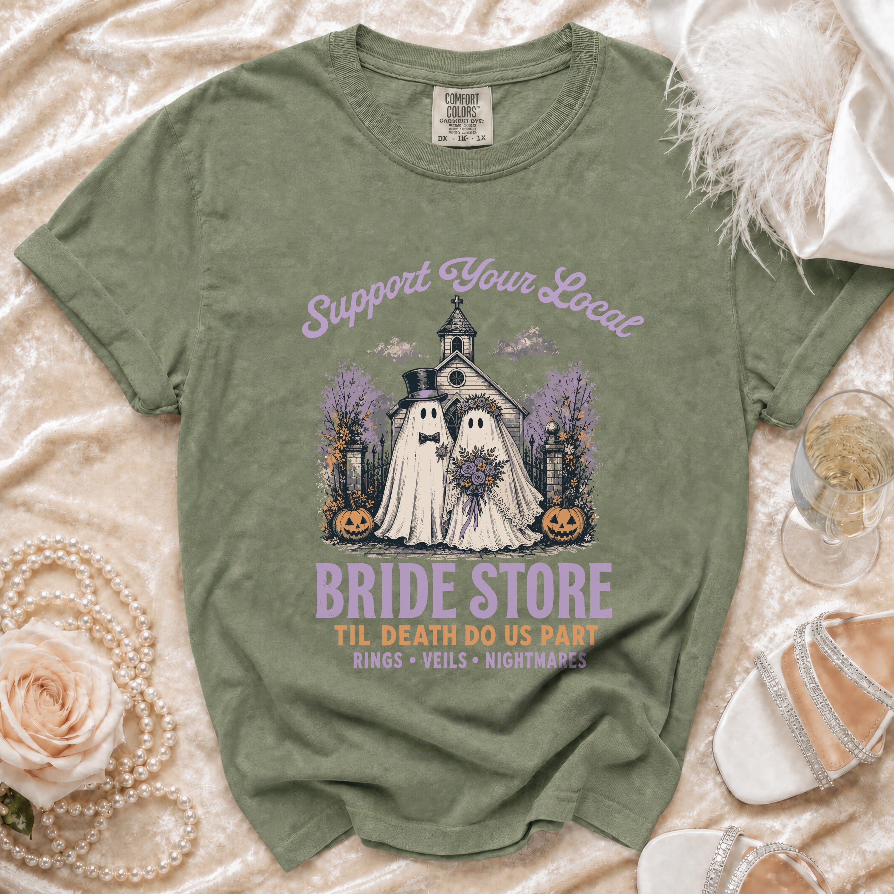 Olive t-shirt with "Support Your Local Bride Store" ghost wedding graphic.