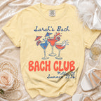 Yellow t-shirt with "Sarah's Bach" and "Bach Club" design for Malibu, CA Summer 2026.