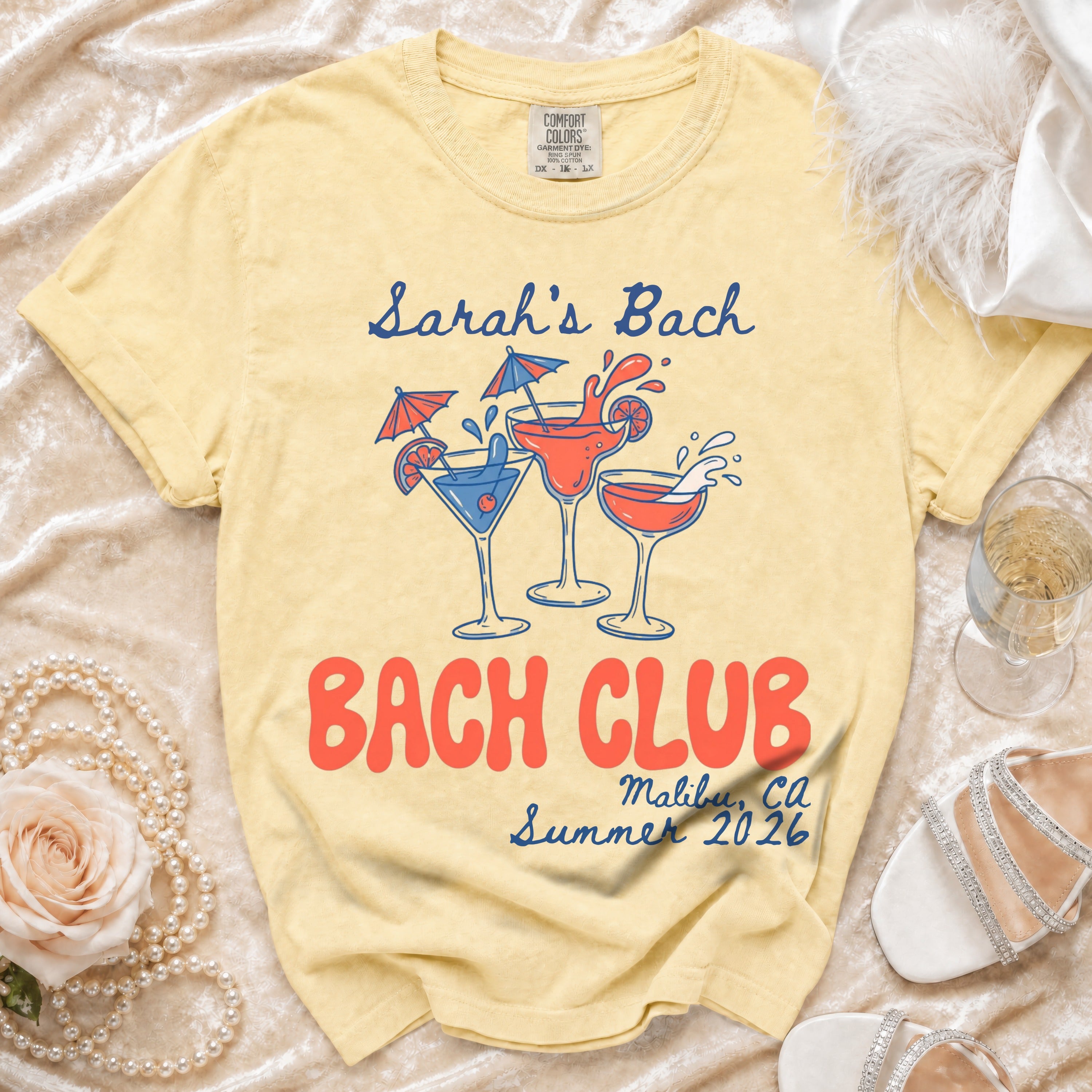Yellow t-shirt with "Sarah's Bach" and "Bach Club" design for Malibu, CA Summer 2026.