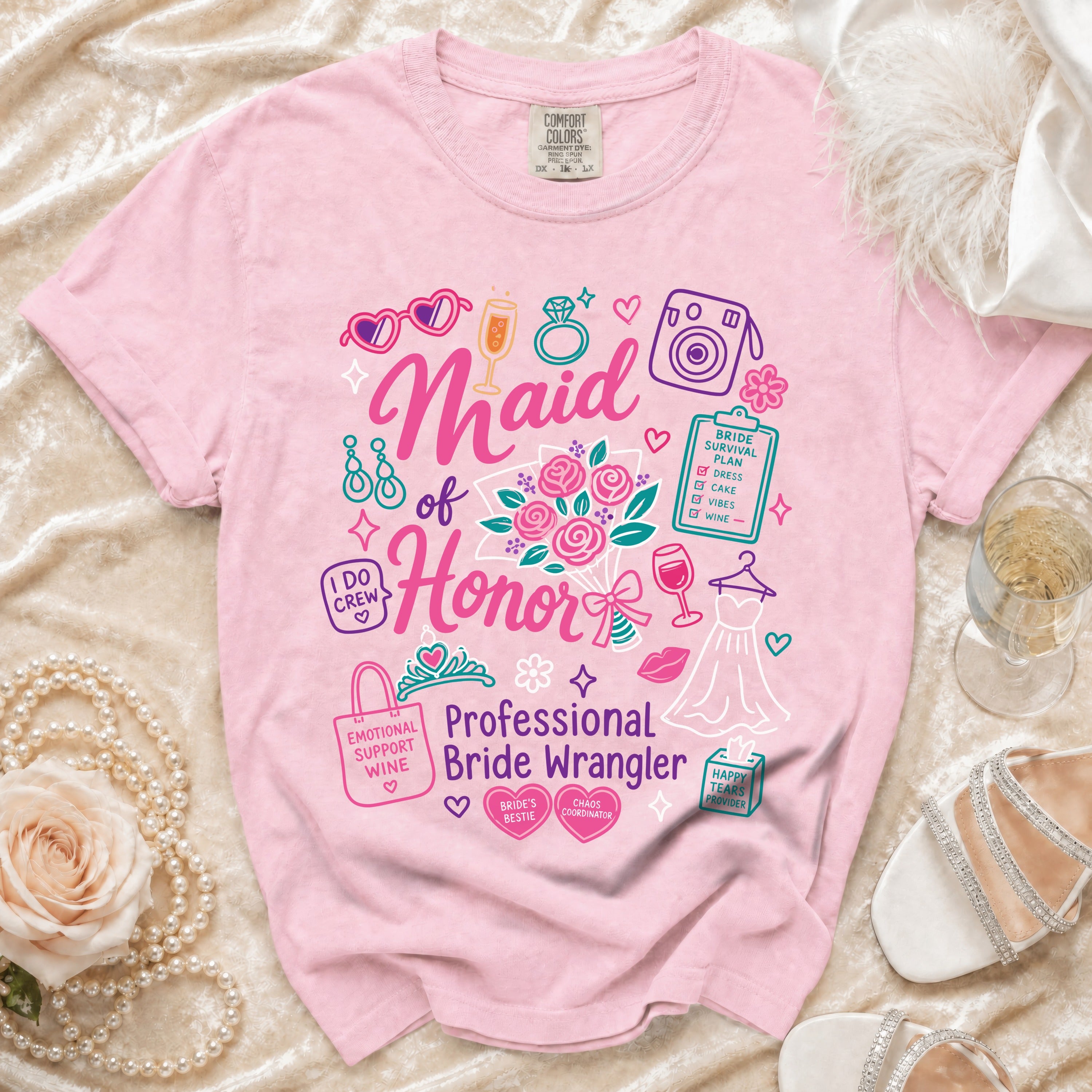 Pink t-shirt with "Maid of Honor: Professional Bride Wrangler" graphic and wedding icons.