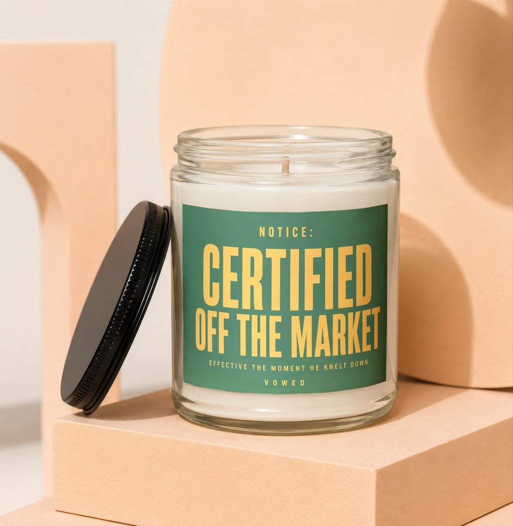 Glass candle with green label reading "NOTICE: CERTIFIED OFF THE MARKET"