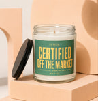 Glass candle with green label reading "NOTICE: CERTIFIED OFF THE MARKET"