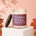 Glass candle with "Certified U-Haul success story" text on label.