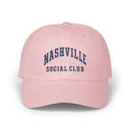 Light pink baseball cap embroidered with dark blue text reading Nashville Social Club on the front.