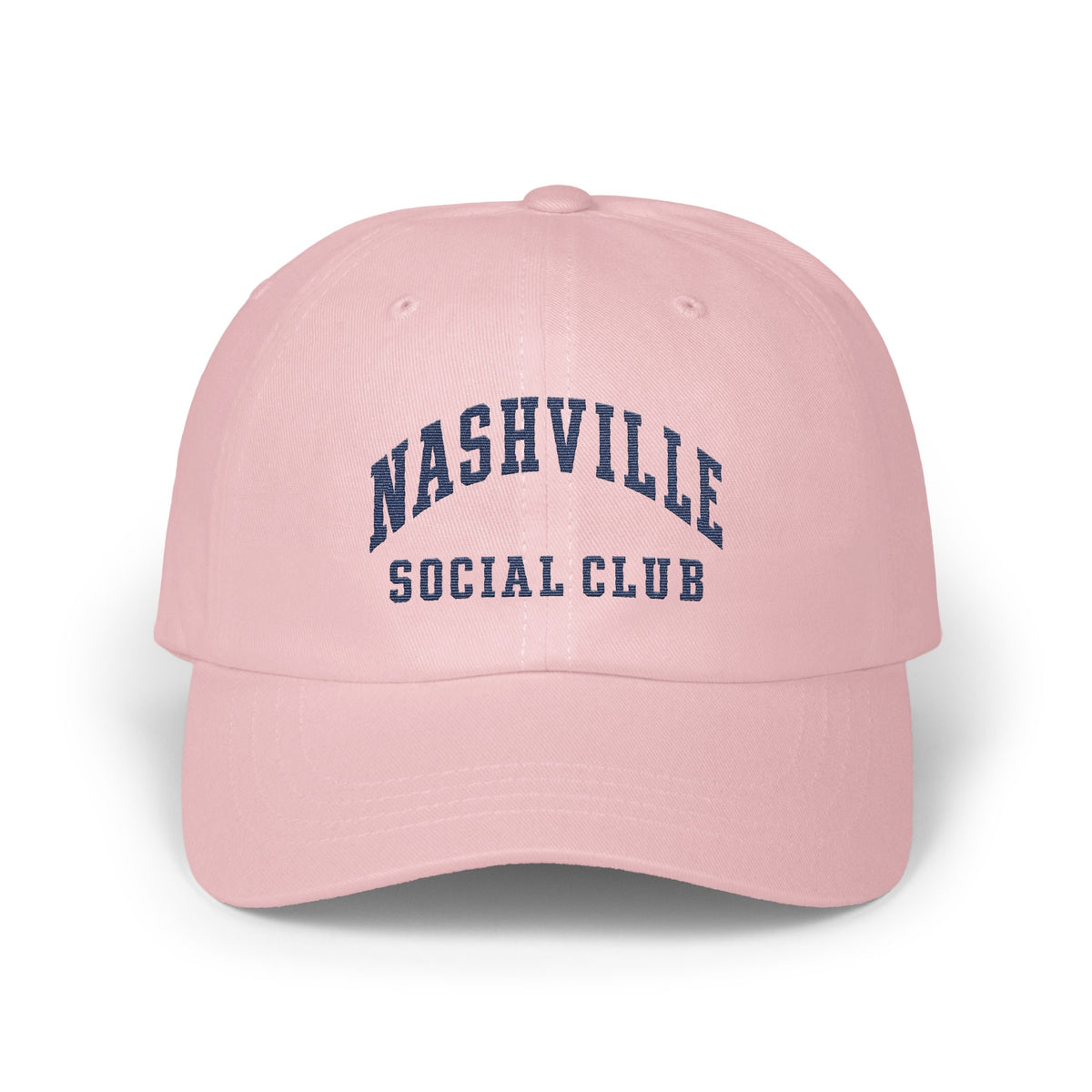 Light pink baseball cap embroidered with dark blue text reading Nashville Social Club on the front.