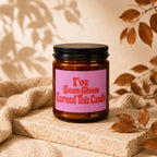 Brown glass candle with pink label that reads "I've Earned This Candle"