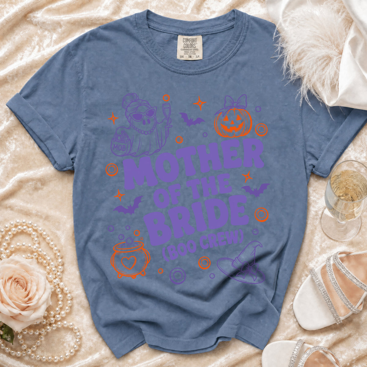 Blue t-shirt with "MOTHER OF THE BRIDE (BOO CREW)" text and Halloween graphics.