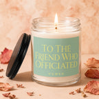 Lit candle in glass jar with text "TO THE FRIEND WHO OFFICIATED".