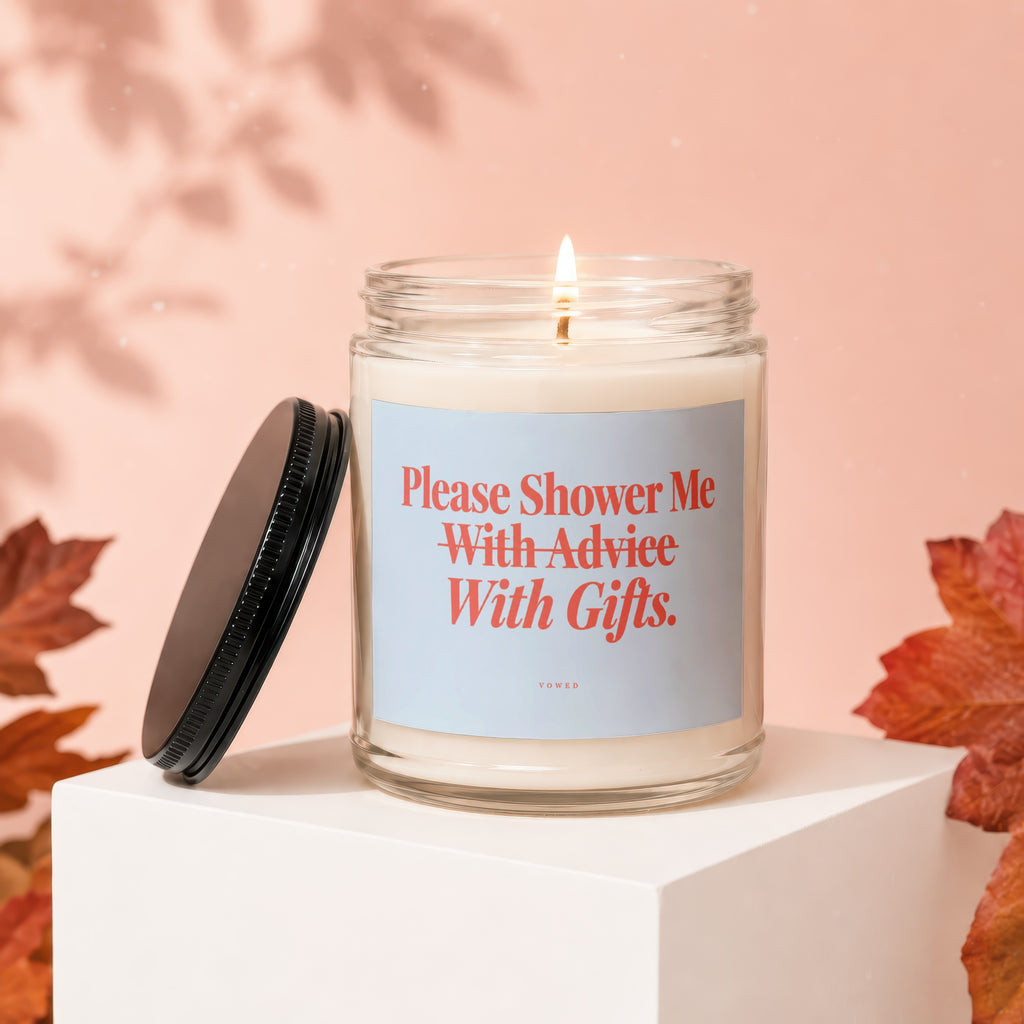 Candle with text "Please Shower Me With Advice. With Gifts."