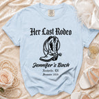 Light blue t-shirt with "Her Last Rodeo" and cowboy boot design.