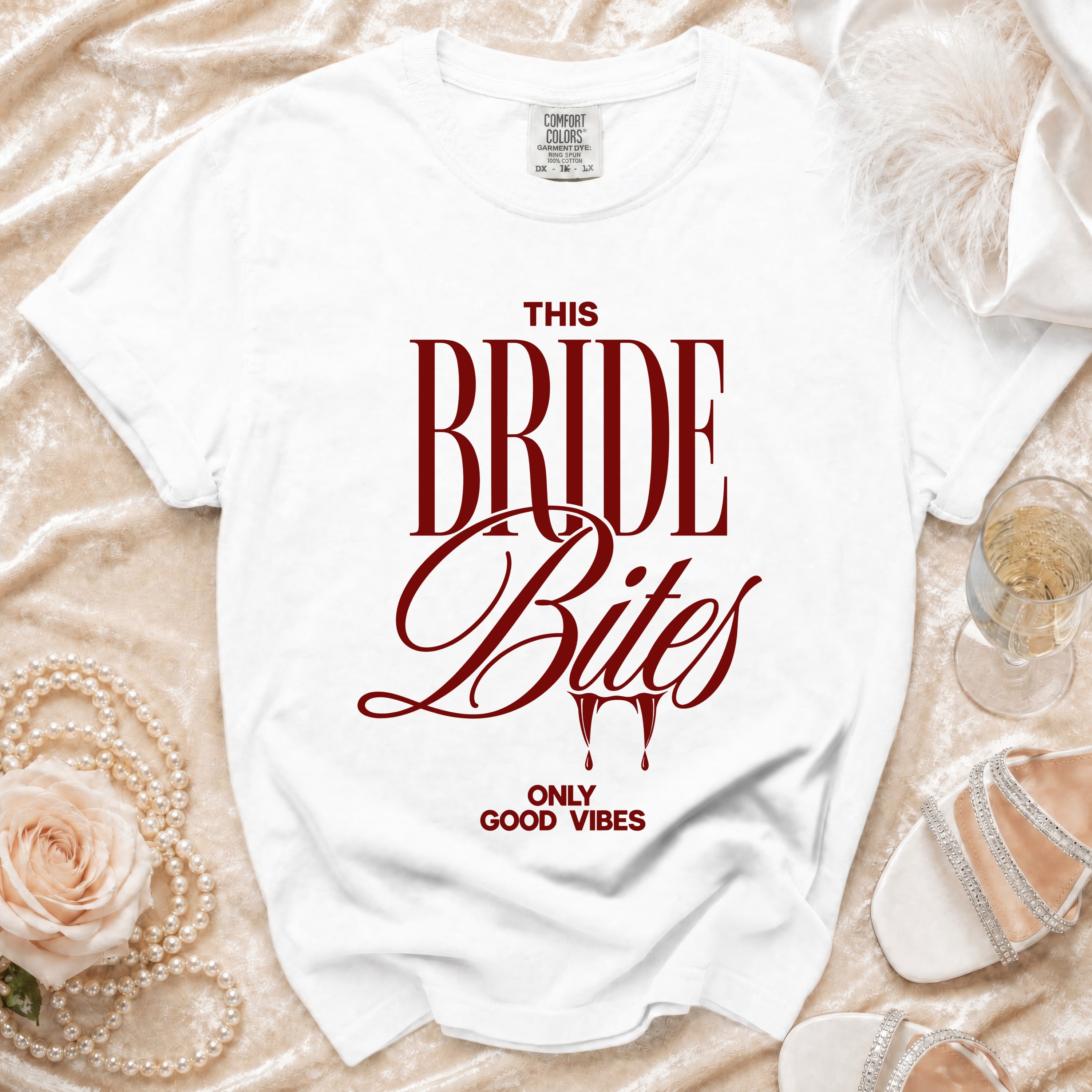 White t-shirt with "THIS BRIDE Bites ONLY GOOD VIBES" text.
