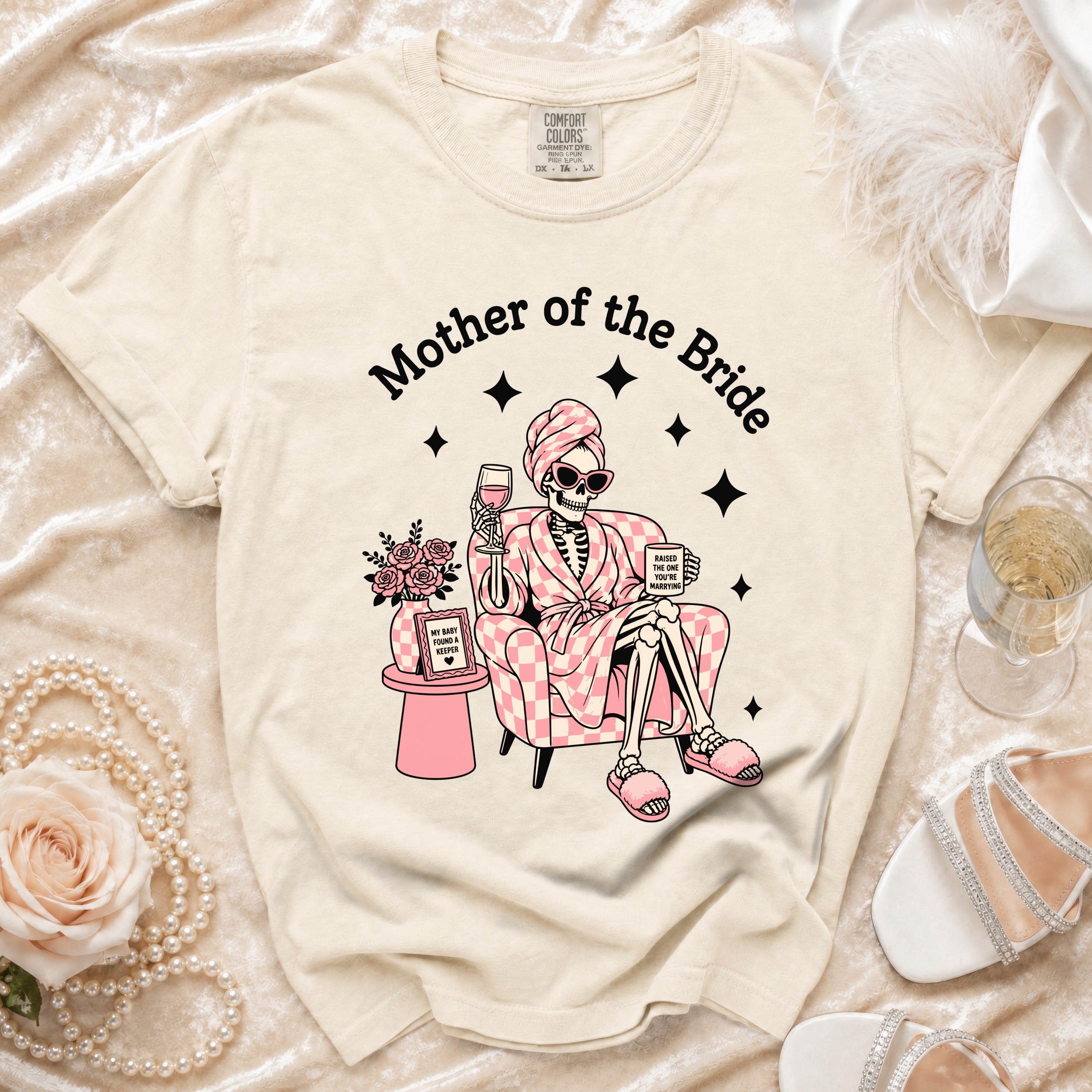 Cream t-shirt with "Mother of the Bride" and skeleton graphic.