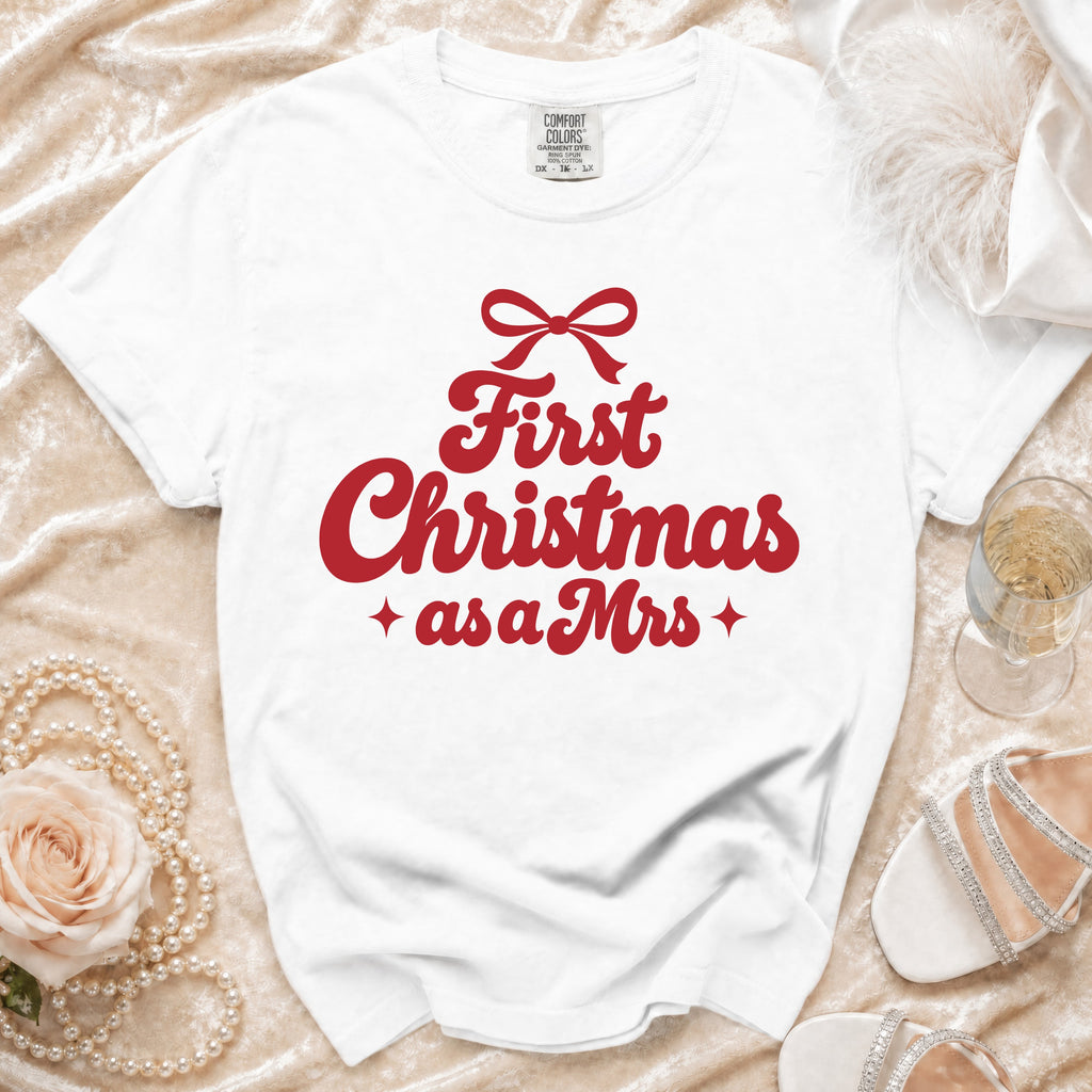 White Comfort Colors t-shirt with "First Christmas as a Mrs" text.