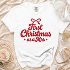White Comfort Colors t-shirt with "First Christmas as a Mrs" text.