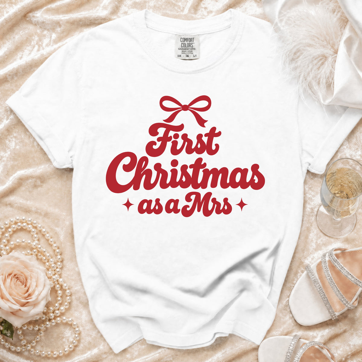 White Comfort Colors t-shirt with "First Christmas as a Mrs" text.