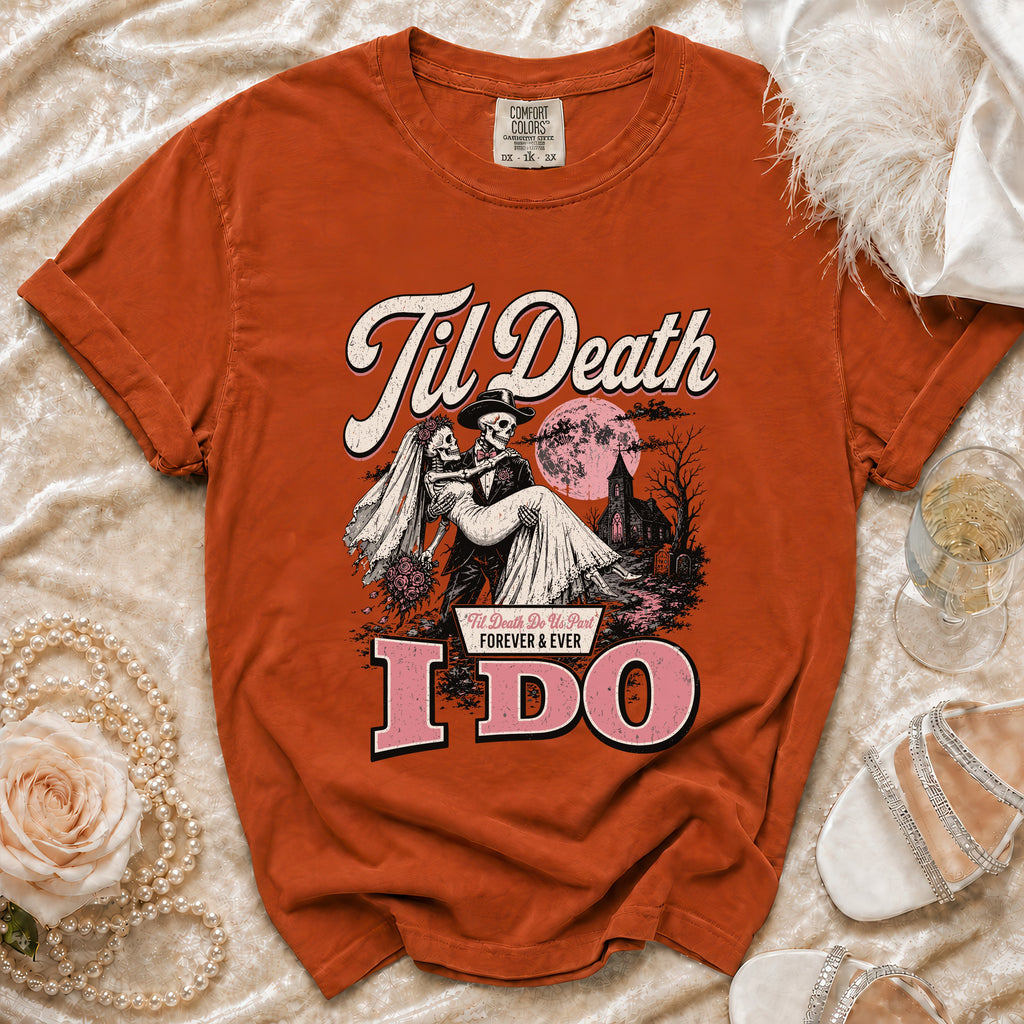 Orange t-shirt with skeleton bride and groom graphic reading "Til Death" and "I DO".