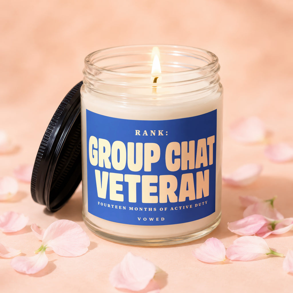 Candle with blue label reading "RANK: GROUP CHAT VETERAN".