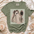 T-shirt with graphic of a ghost holding lipstick and a mirror.