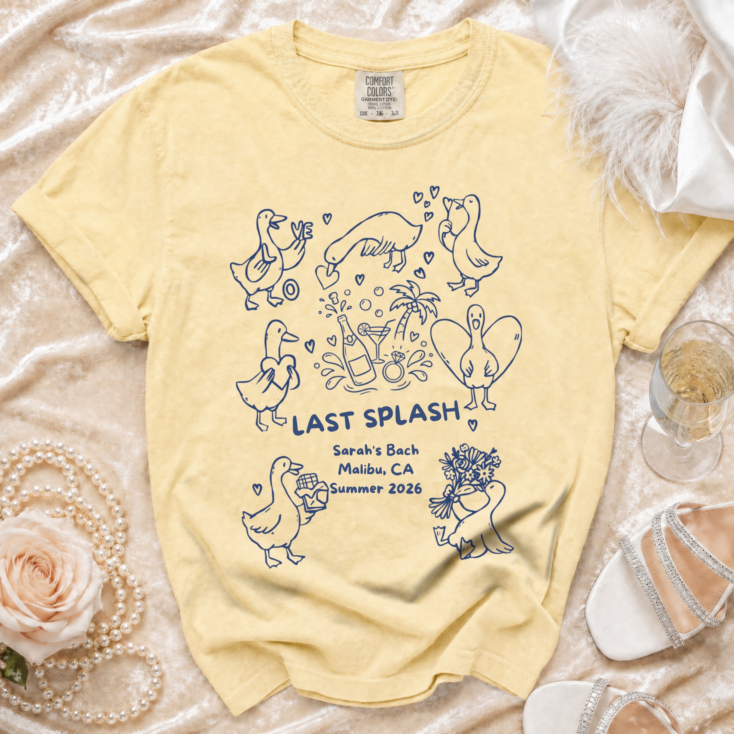 Yellow t-shirt with "Last Splash Sarah's Bach Malibu CA Summer 2026" and duck illustrations.