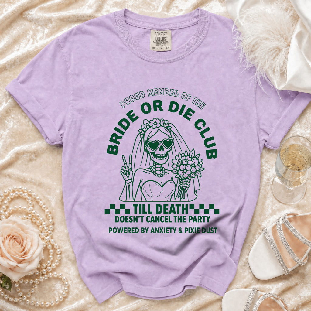 Purple t-shirt with green graphic of skeleton bride saying "Bride or Die Club".