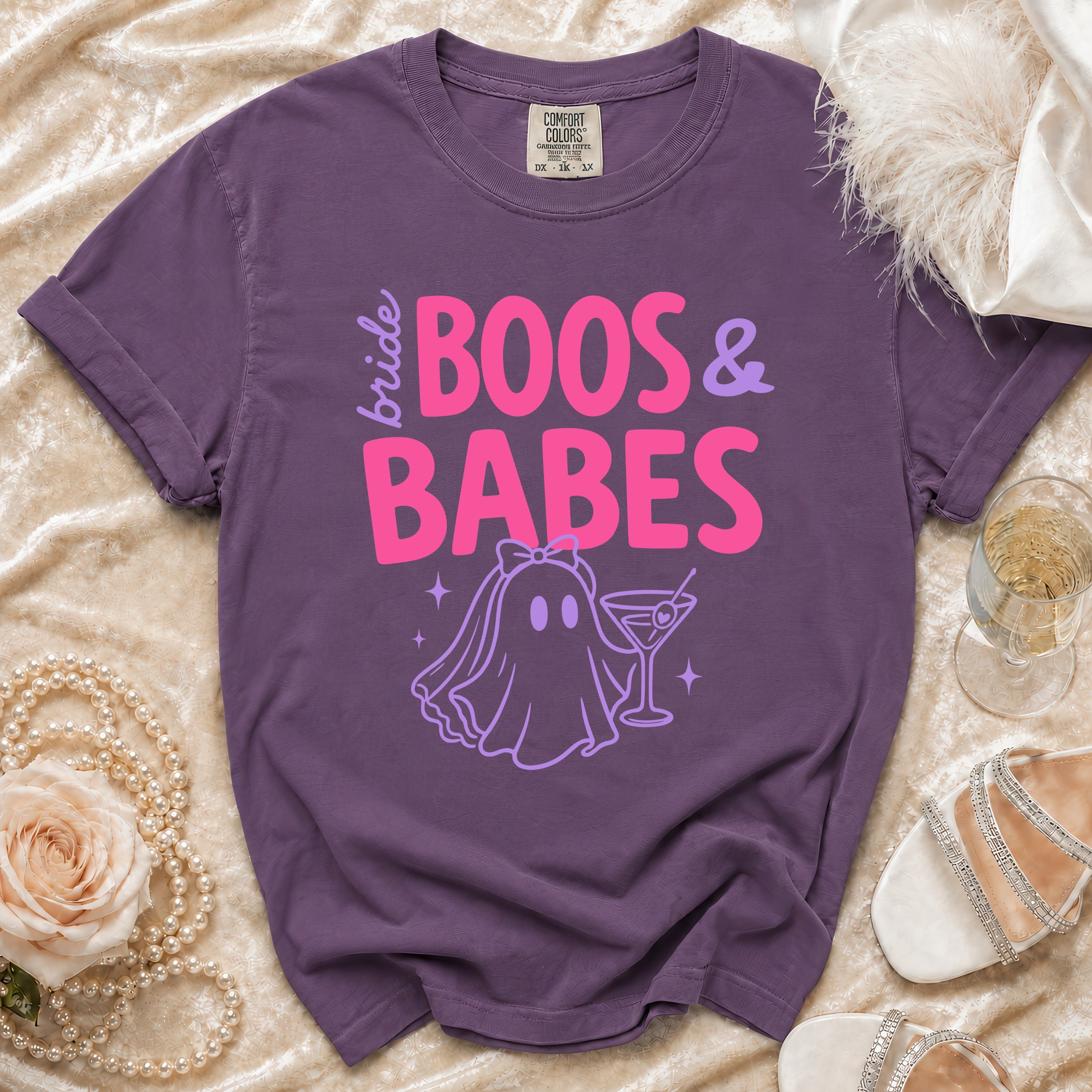 Purple t-shirt with "bride BOOS & BABES" text and ghost bride graphic.