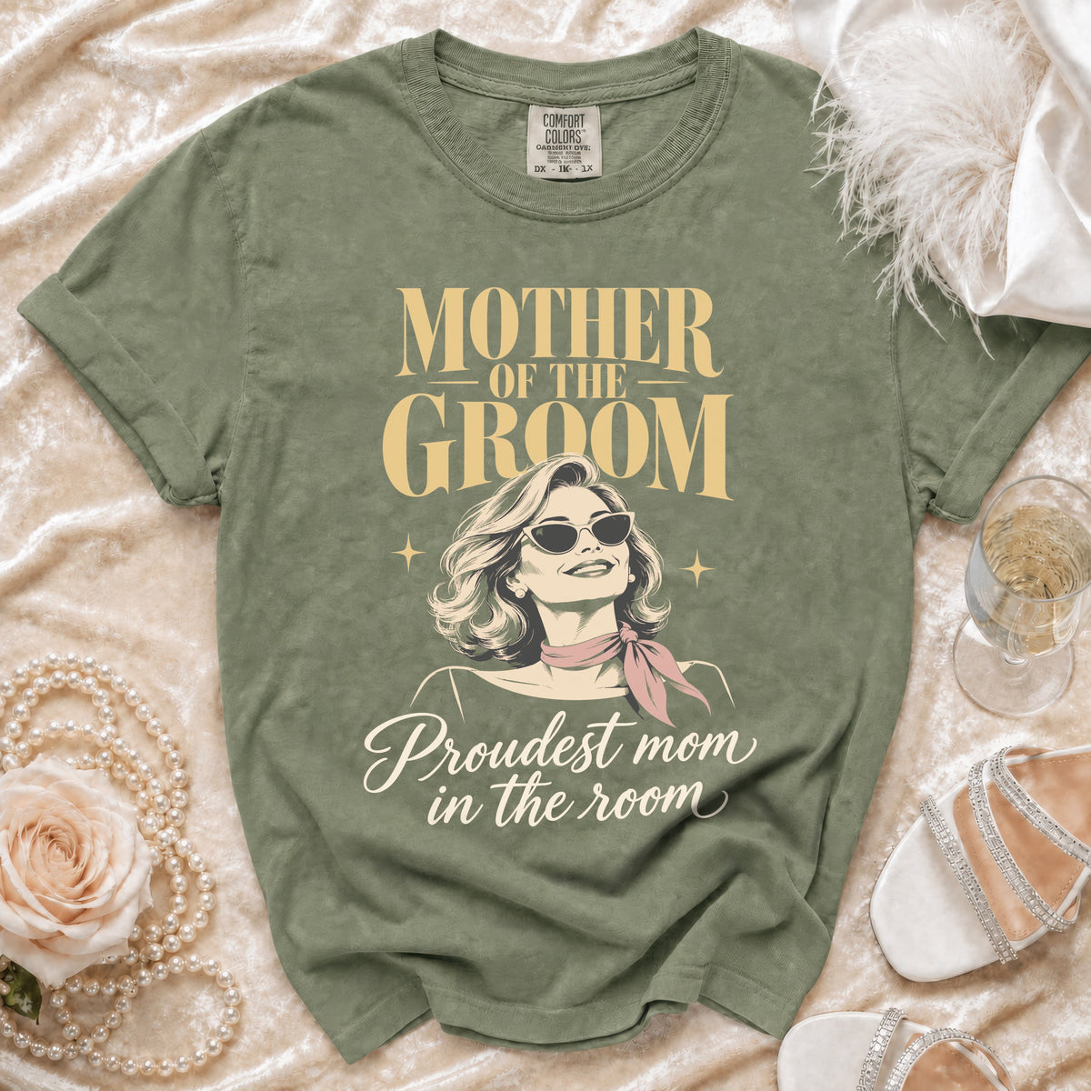 Green t-shirt with "MOTHER OF THE GROOM Proudest mom in the room" text.