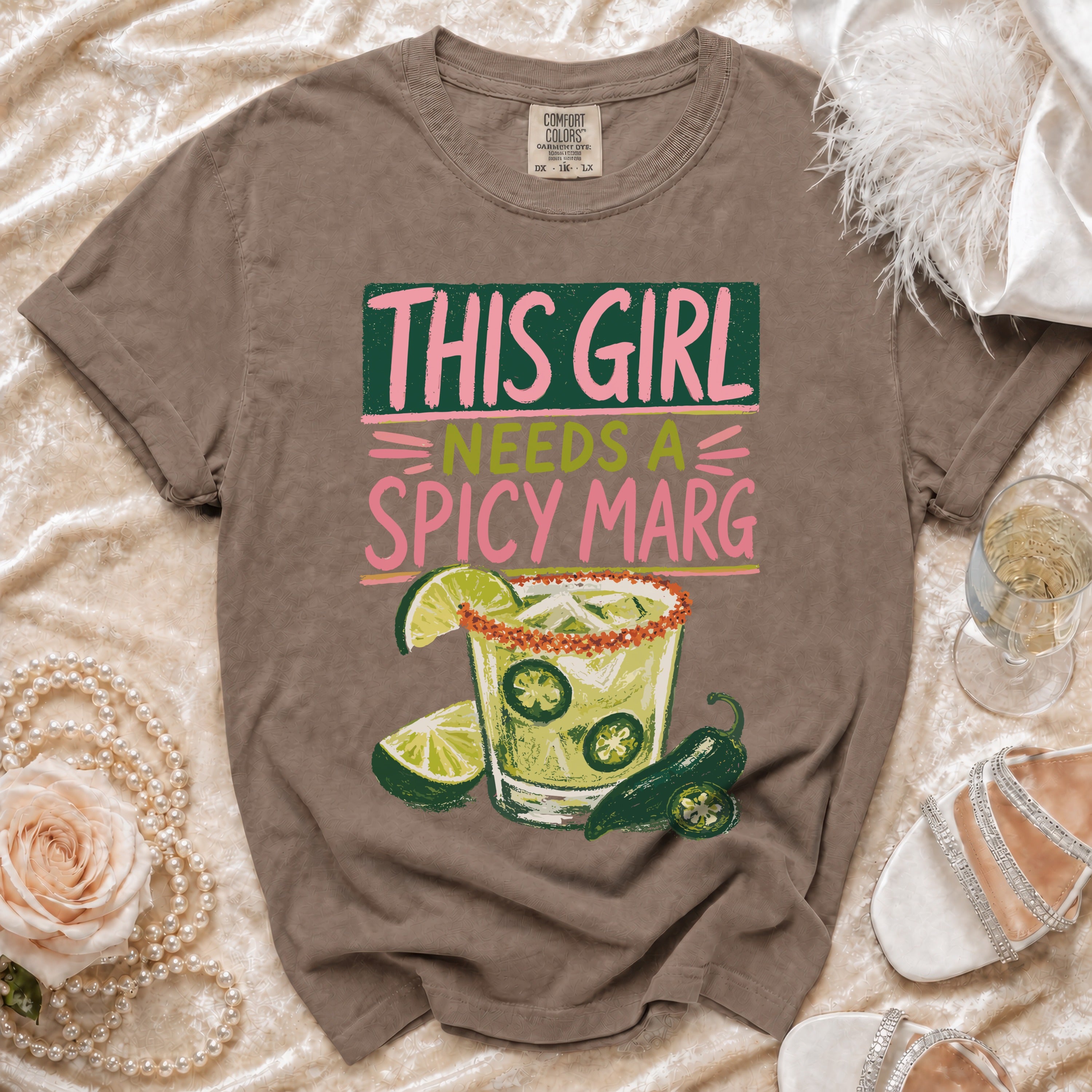 Brown t-shirt with "THIS GIRL NEEDS A SPICY MARG" graphic and a margarita.